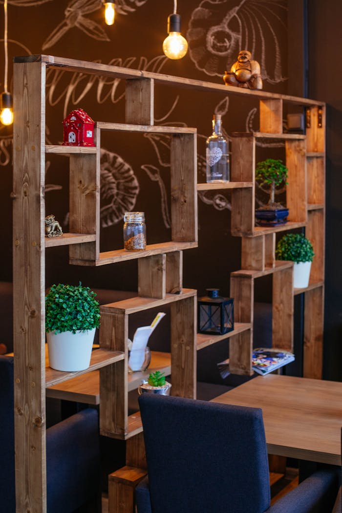 why-choose-us Charming cafe setting featuring wooden shelves, indoor plants, and cozy decor.